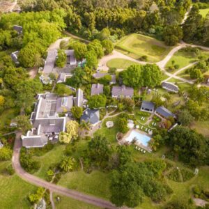 An overhead view of a estate with houses and trees at Hunter's Country House in Plettenberg Bay