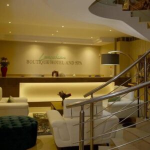 A lobby with white furniture in a building at K Partners' Boutique Hotel & Spa in Langebaan