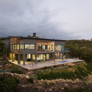 An aerial view of a house on a hill at Kooboo Berry Ocean View, Self Catering Guesthouse in Wilderness