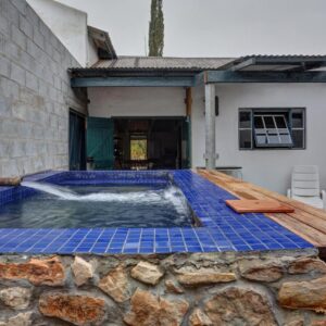 A plunge pool in a house with blue tiles at Kookfontein Farm Cottages in Lambertʼs Bay