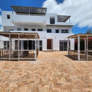 A large white house with two gazebos in front of it at Langebaan Guest House in Langebaan