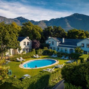 An aerial view of a house with a swimming pool at Le Quartier Francais in Franschhoek