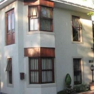 The two-storey guest house exterior at Magnolia Place Guest Houses in Stellenbosch