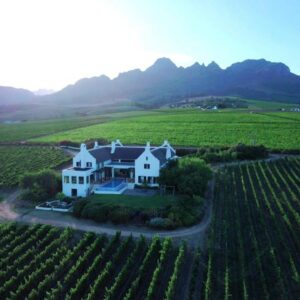 An aerial view of a house in the middle of a vineyard at Manor at Longridge in Helderberg
