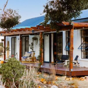 A house with a deck with two chairs on it at Nama Rocklands in Clanwilliam