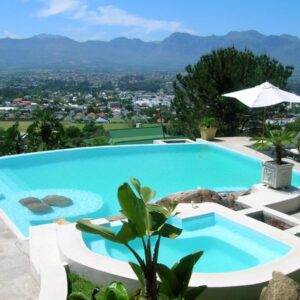 A swimming pool with a view of the mountains at Perle Du Cap in Paarl