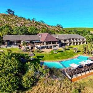An aerial view of a house with a swimming pool at Piekenierskloof Mountain Resort by Dream Resorts in Citrusdal