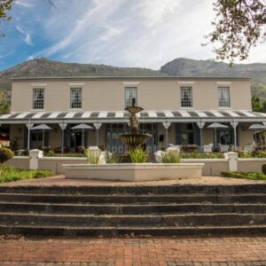 A building with a fountain in front of it at Pontac Manor Hotel & Restaurant in Paarl