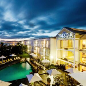 A view of a hotel with a swimming pool at Protea Hotel by Marriott Knysna Quays in Knysna