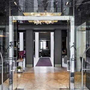 An entrance to a building with a glass door at Queen Victoria Hotel by NEWMARK in Cape Town