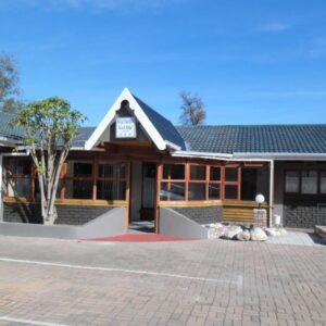 A building with a brick driveway in front of it at Reheifo Lodge in George