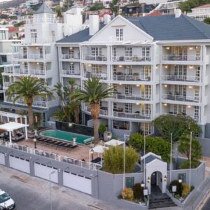 An aerial view of a large white apartment building at Romney Park Luxury Apartments by The Stay Collection in Cape Town