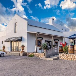 A white house with a car parked in front of it at Sea Castle's Paternoster in Paternoster