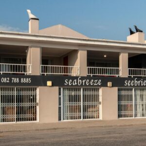 A building on the side of a street at Seabreeze Apartments in Lambertʼs Bay