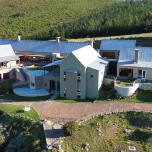 An aerial view of a house on a hill at Segulah Guesthouse in Mossel Bay