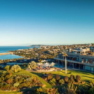An aerial view of a mansion with the ocean in the background at Sky Villa Boutique Hotel in Plettenberg Bay