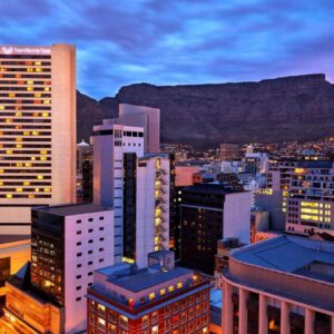 A view of a city with a mountain in the background at Southern Sun Cape Sun in Cape Town