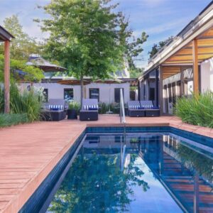 A swimming pool in the backyard of a house at Southern Sun de Wagen in Stellenbosch