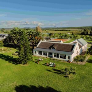 An aerial view of a large house with a yard at Springfontein River Lodge in Stanford