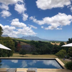 A swimming pool with a view of the sky at Sugarbird Manor in Stellenbosch
