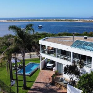 An aerial view of a house with a swimming pool at Sunshowers Plett in Plettenberg Bay