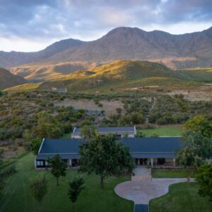 An aerial view of a house in the mountains at Swartberg Private Game Lodge in Oudtshoorn