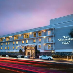 A building with a car parked in front of it at The Commodore Hotel in Cape Town