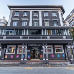 A building on a city street with a store at Grand Daddy Boutique Hotel in Cape Town