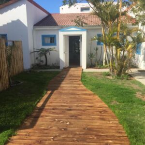 A walkway leading to a house at The Green Palm Cottage in Plettenberg Bay