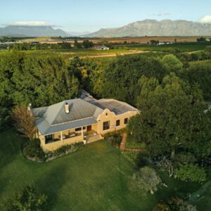 An aerial view of a house with a yard at The Neighbours Farm - Homestead in Stellenbosch