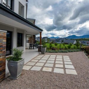 A courtyard of a house with a patio at The Peaks - Kingswood Golf Estate in George