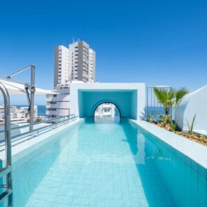A swimming pool on the roof of a building at The Tropicana Hotel in Cape Town