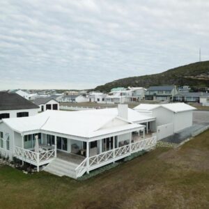 An aerial view of a house with a white roof at Tides' Song in Agulhas