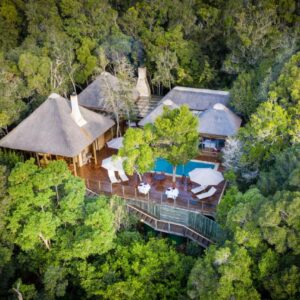 An aerial view of a house in the forest at Trogon House and Forest Spa in The Crags
