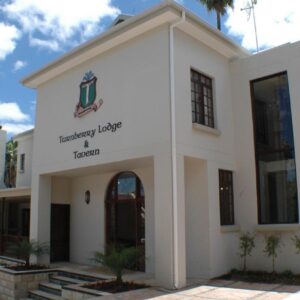 A white building with the words therapy house and hospital at Turnberry Boutique Hotel in Oudtshoorn