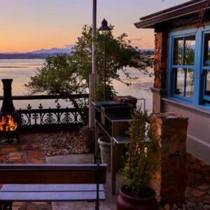 A lagoon-view terrace at sunset at TwoAngels in Knysna