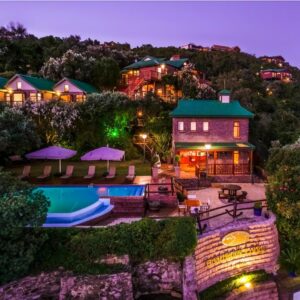 An aerial view of a house with a swimming pool at Under the Boardwalk B&B Guest House in Wilderness