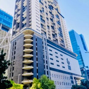 A tall building with a spiral in a city at Urban Elephant Hotels, 16 On Bree in Cape Town