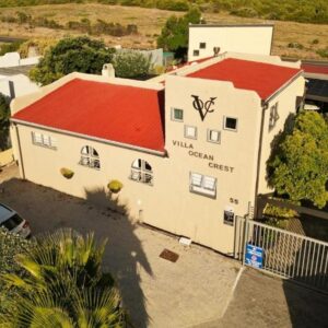 An overhead view of a building with a red roof at Villa Ocean Crest B&B in Gansbaai