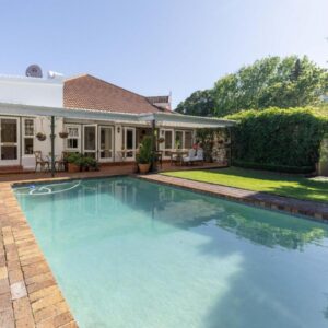A swimming pool in the backyard of a house at Villa Puccini in Cape Town