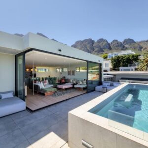A house with a swimming pool and a patio at Villa Rohalya in Cape Town