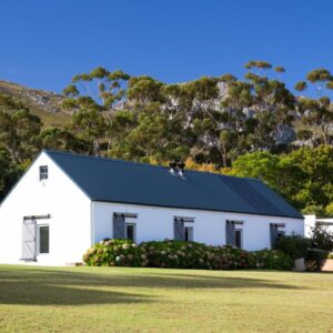 A white house with a blue roof at White Water Farm in Stanford