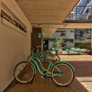 A green bike parked on the side of a building at WINK Aparthotel Quiver Tree in Stellenbosch