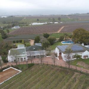 An aerial view of a home with solar panels on the roof at Zonnevanger Guesthouse in Noorder-Paarl