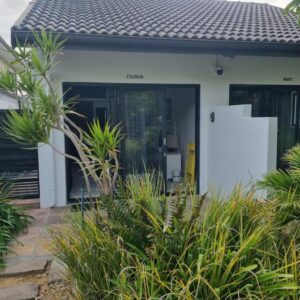 12onParkesLane: a house with a door open in a garden