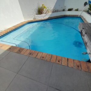 20 Belladonna Avenue Vredehoek: a large blue swimming pool in a building