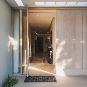 23 Grace: an open door of a house with a hallway