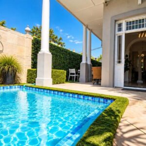 4 on Varneys Guest House: a swimming pool in front of a house