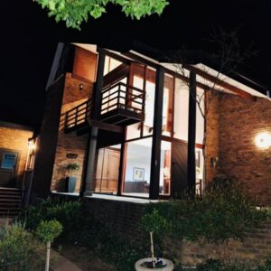 41 on RUPERT: a brick house at night with the lights on