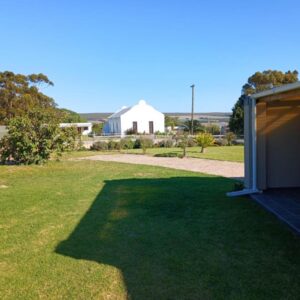 5 on Church Self Catering: a large yard with a white building in the background